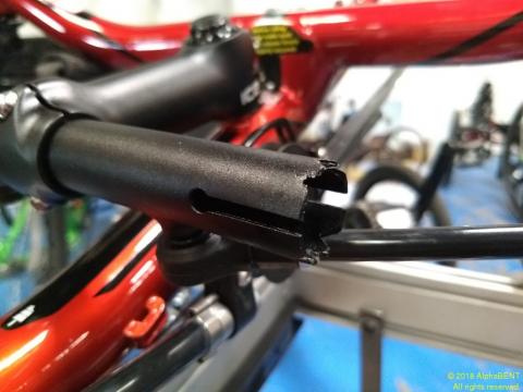 Handlebar clamp tube with serrated edge is half of the pinking mechanism